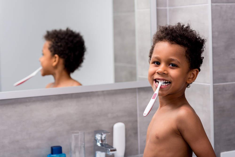 Little boy brushing teeth