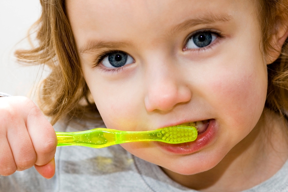 Little girl brushing teeth